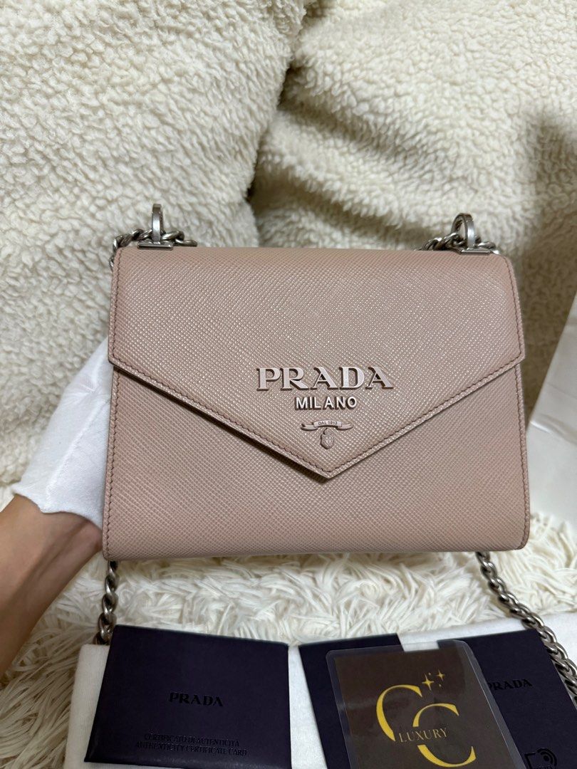 Prada Saffiano Monochrome Envelope (Category: Luxury Bags & Wallets) located in Manila. Submitted by ccluxuryy (Listing ID 1394551549, Image 3). Description: Prada Saffiano Envelope Flap Two Way Bag in Beige Pink Very good condition Comes with dust bag, authenticity card and paper bag ✨ can be worn as crossbody or shoulder bag ✨ fits iphone 16 pro max P49k only Location: Merville, Paranaque Meet up: MOA, DLSU, Newport, Greenbelt, BGC Delivery: Gr