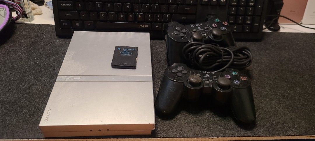Sony PlayStation 2 SCPH-77001 Console (Category: PlayStation) located in Cebu City. Submitted by AUDIOWOLF (Listing ID 1394505844, Image 3). Description: - Sony PlayStation 2 console (SCPH-77001) - Silver color - Includes two controllers - Includes a memory card - NTSC/UC region - Serial number: PL174755133 -All original not modded and opened.