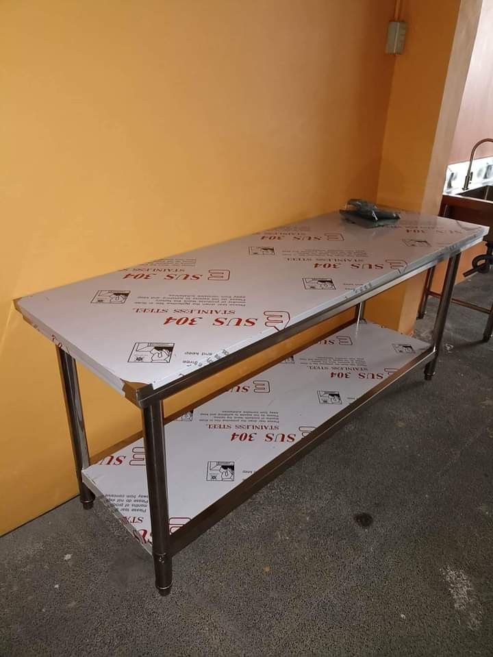 Stainless Steel Kitchen Table FOR SALE (Category: Tables & Sets) located in Manila. Submitted by davearonda40644 (Listing ID 1394529024, Image 2). Description: - Durable SUS 304 stainless steel construction - Dimensions:MANY DIFFERENT SIZES - Features a lower shelf for extra storage - Perfect for food preparation and work surface - Multiple units available.
