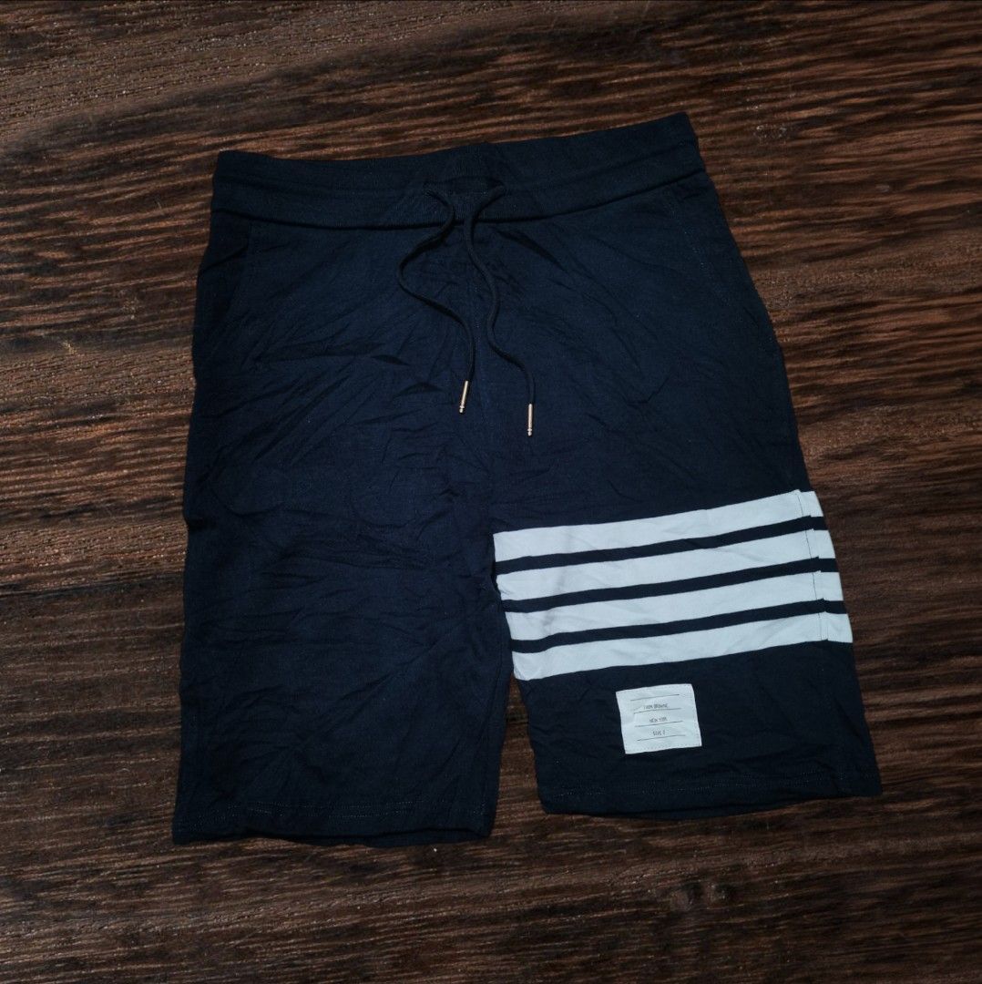 Thom Browne Navy Shorts with White Stripes (Category: Luxury Apparel) located in San Carlos City. Submitted by heverlim (Listing ID 1394438694, Image 1). Description: Thom browne navy shorts 30-34 waist, 21 length Brand new condition 400 + sf.
