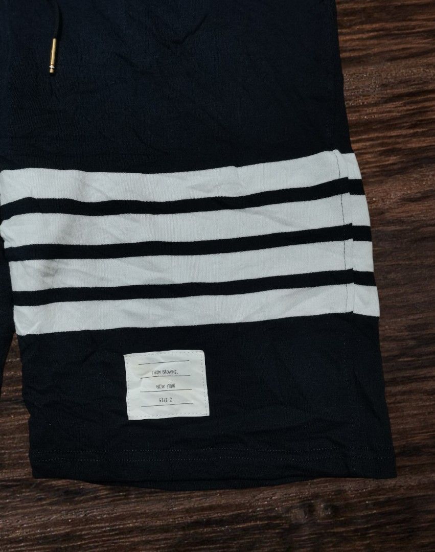 Thom Browne Navy Shorts with White Stripes (Category: Luxury Apparel) located in San Carlos City. Submitted by heverlim (Listing ID 1394438694, Image 2). Description: Thom browne navy shorts 30-34 waist, 21 length Brand new condition 400 + sf.