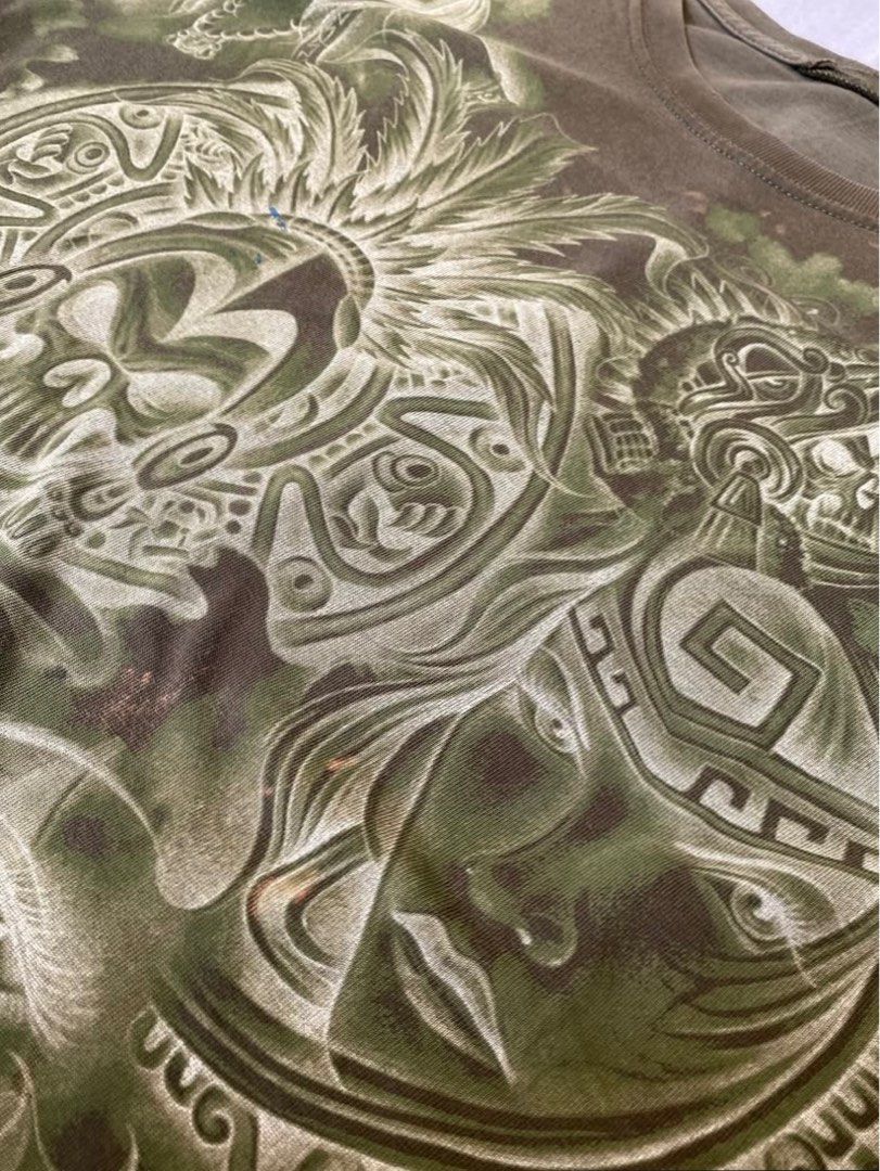 Vintage Tribal Tee (Category: Tshirts & Polo Shirts ) located in Lipa City. Submitted by uoniandre (Listing ID 1394455942, Image 2). Description: no size on tag (see measurements below) L: 28” W: 22.5” issue/s: no tag, small bleach and paint stains, pinholes (shown in pic) + shipping fee.