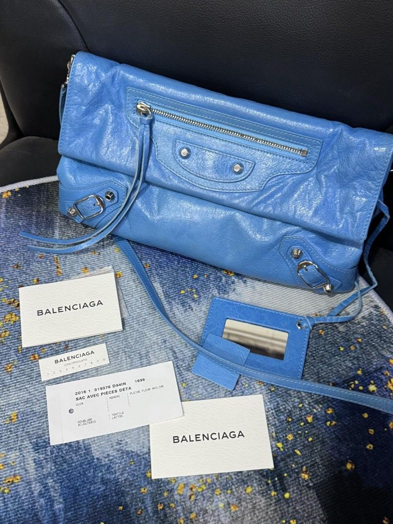 Balenciaga Envelop Bag (Category: Luxury Bags & Wallets) located in Pasig City. Submitted by lovelygrace_04 (Listing ID 1394702904, Image 1). Description: Authentic balenciaga envelop bag - Vibrant blue color - Zip closure - Exterior pocket - Detachable shoulder strap - Includes original tags and mirror - Silver hardware - Classic design - Perfect for everyday or special occasions complete inclusion with cards dustbag & box..pm me if interested.