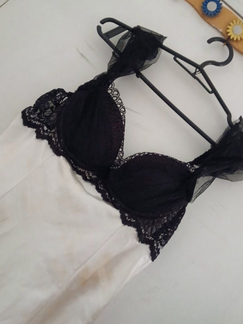 Black and White Dress (Category: Dresses) located in Bulacan. Submitted by fadeea412 (Listing ID 1394672866, Image 1). Description: - Black lace-trimmed bra top - Delicate tulle straps - White satin fabric - Black bow accents - Feminine design.
