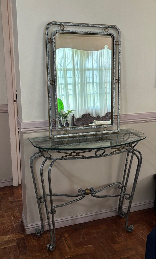 Console table with mirror (bulky) (Category: Other Home Furniture) located in San Fernando. Submitted by trigo91 (Listing ID 1394627432, Image 1). Description: Console table Material: metal, removable glass top Dimensions: L90.5cm x W39cm x H82.5cm Mirror Material: metal frame, glass Dimensions: L60cm x W2.5cm x H82.5cm Item is in San Fernando Pampanga. Buyer to arrange shipping. .