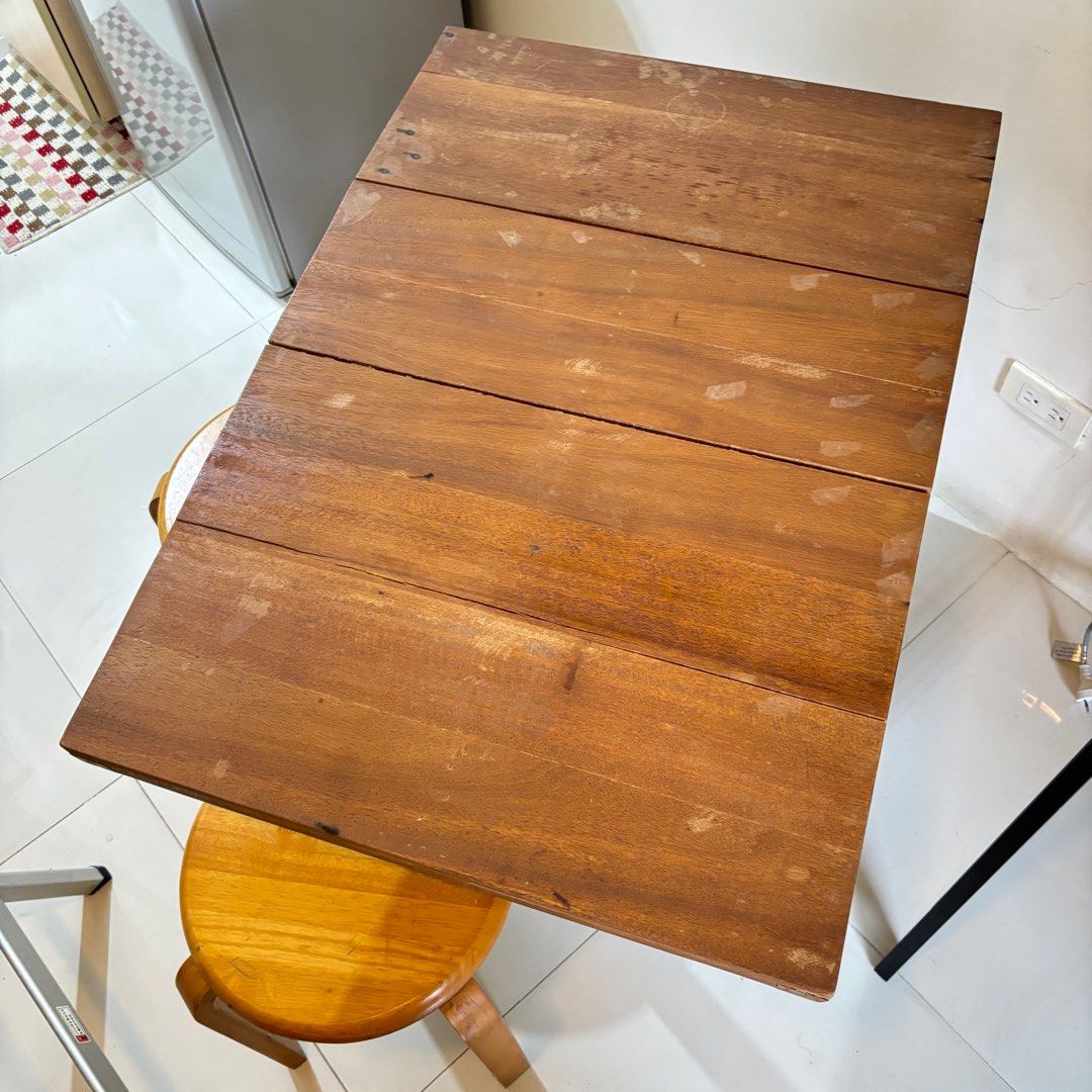 Foldable Rustic Wooden Table (Category: Tables & Sets) located in Paranaque City. Submitted by _mrs.j (Listing ID 1394674958, Image 3). Description: Great as coffee table or dining table for condo Seats 4-6 people Stools not included Dimensions: One side open L=87cm W=60cm H=73.7cm Both side open L=147cm W=60cm H=73.7cm RFS: New tenant requested to remove from unit.
