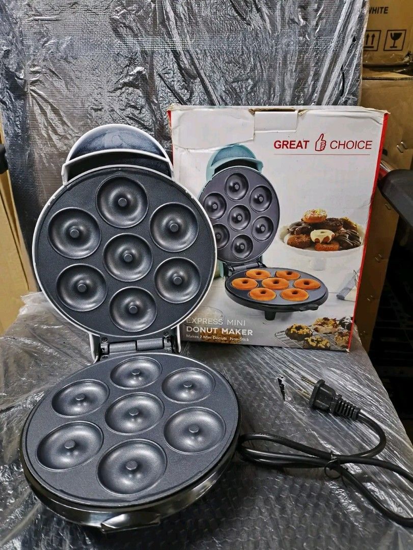 Great Choice Express Mini Donut Maker (Category: Coffee Machines & Makers) located in Caloocan City. Submitted by surplusandbnewshop (Listing ID 1394694564, Image 1). Description: - Make delicious mini donuts at home! - Features a non-stick surface for easy cleaning. - Compact design, ideal for small kitchens. - Comes with a power cord for convenient use. - See the finished product on the box!.
