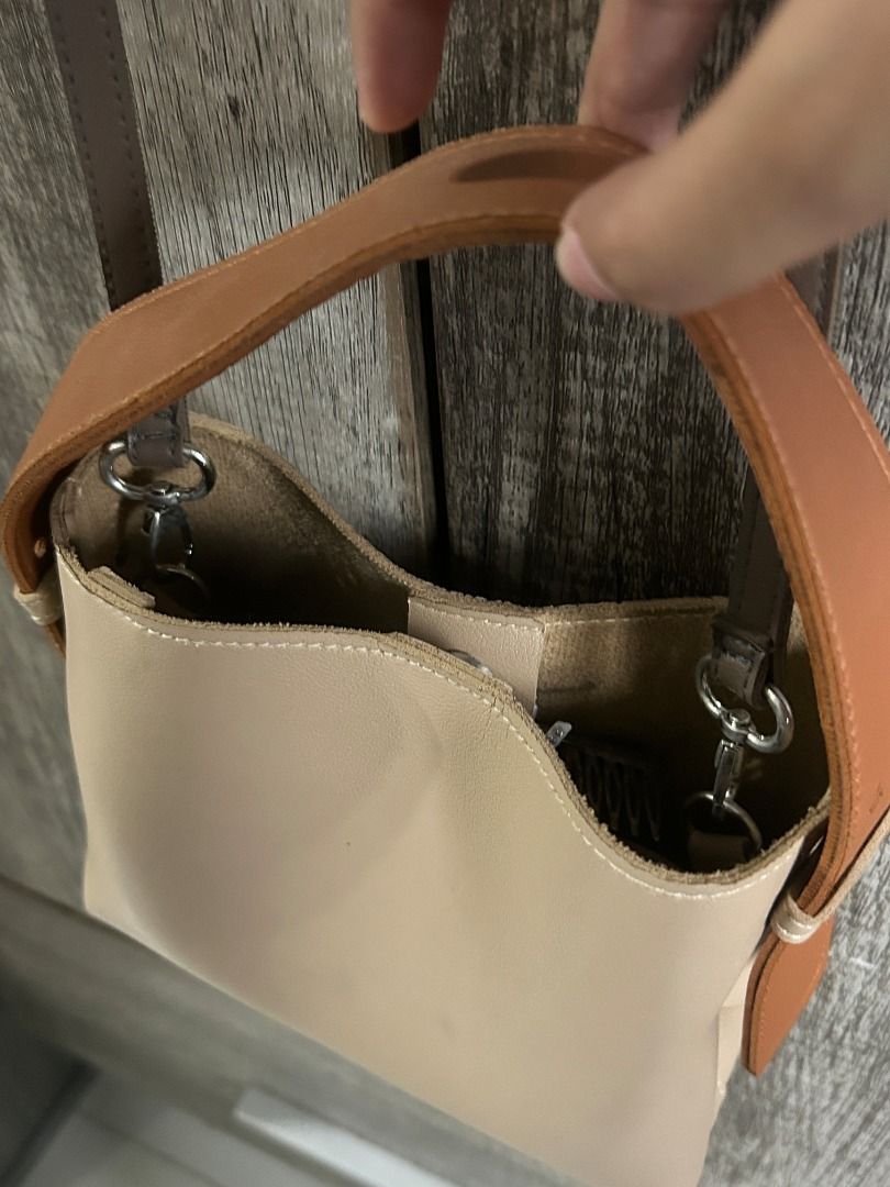 GVN The Label Multi Micro Bag in Taupe (Category: Luxury Bags & Wallets) located in Manila. Submitted by dream2doubt (Listing ID 1394696953, Image 2). Description: hard to let go! phase out product/not available in website anymore - comes with 2 extra straps (see last photo) - very spacious, has 3 compartments inside - can be worn 2 ways (handbag and sling - both are adjustable) - has a stain inside (see pictures) rfs: decluttering.