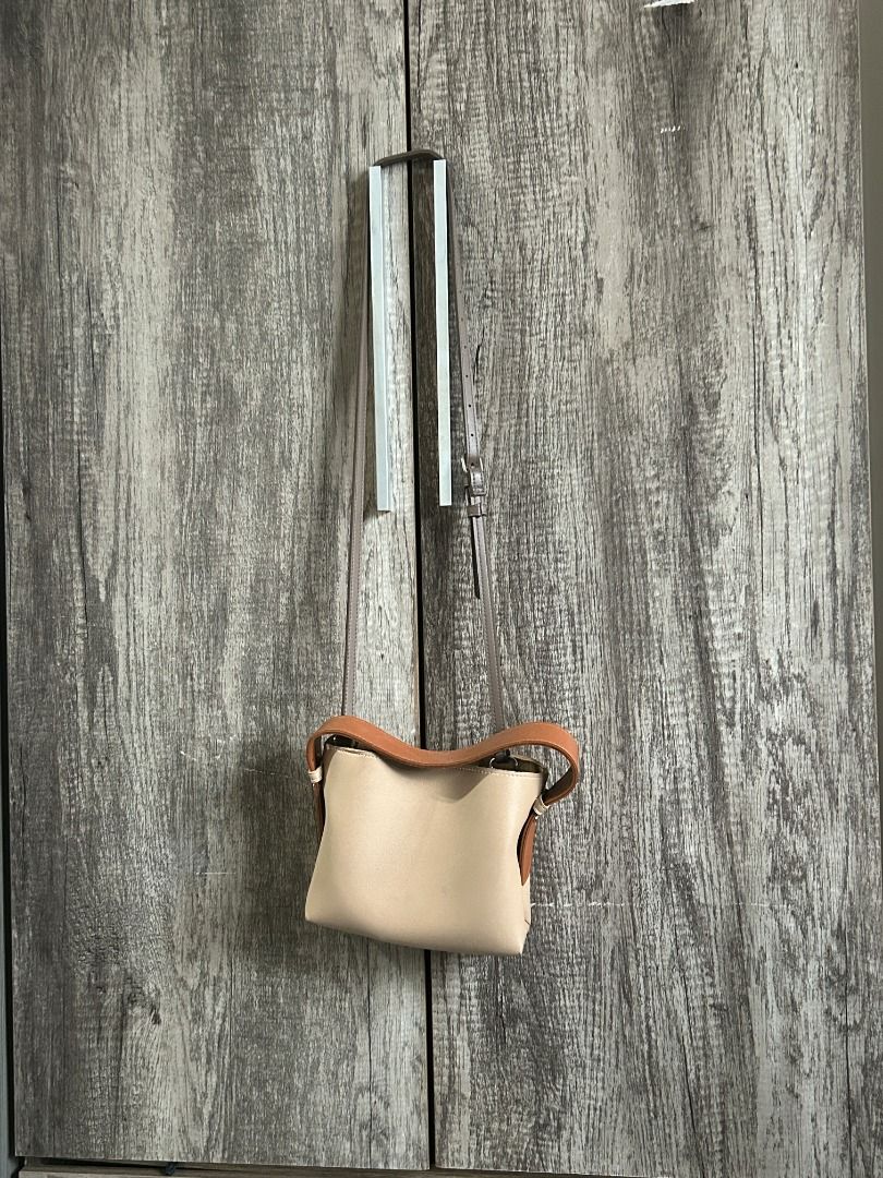 GVN The Label Multi Micro Bag in Taupe (Category: Luxury Bags & Wallets) located in Manila. Submitted by dream2doubt (Listing ID 1394696953, Image 1). Description: hard to let go! phase out product/not available in website anymore - comes with 2 extra straps (see last photo) - very spacious, has 3 compartments inside - can be worn 2 ways (handbag and sling - both are adjustable) - has a stain inside (see pictures) rfs: decluttering.