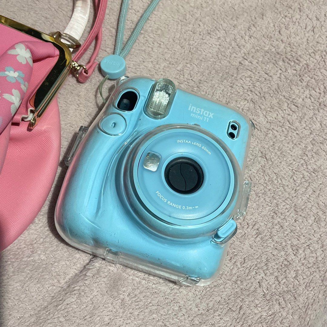 Instax Mini 11 (w/ Sakura bag for free) (Category: Cameras) located in Asingan. Submitted by dine0348 (Listing ID 1394680798, Image 2). Description: RFS: upgrade No issue Inclusions: - camera - sakura instax bag - clear case - hand strap No box..