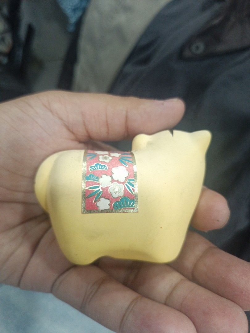 Japanese Ceramic Tiger Figurine (Category: Other Home Decor) located in Quezon City. Submitted by bjetp (Listing ID 1394763896, Image 2). Description: - Adorable ceramic tiger figurine - Features a charming floral design - Painted in soft yellow with black stripes - Cute, smiling face - Ideal decorative piece moving out.