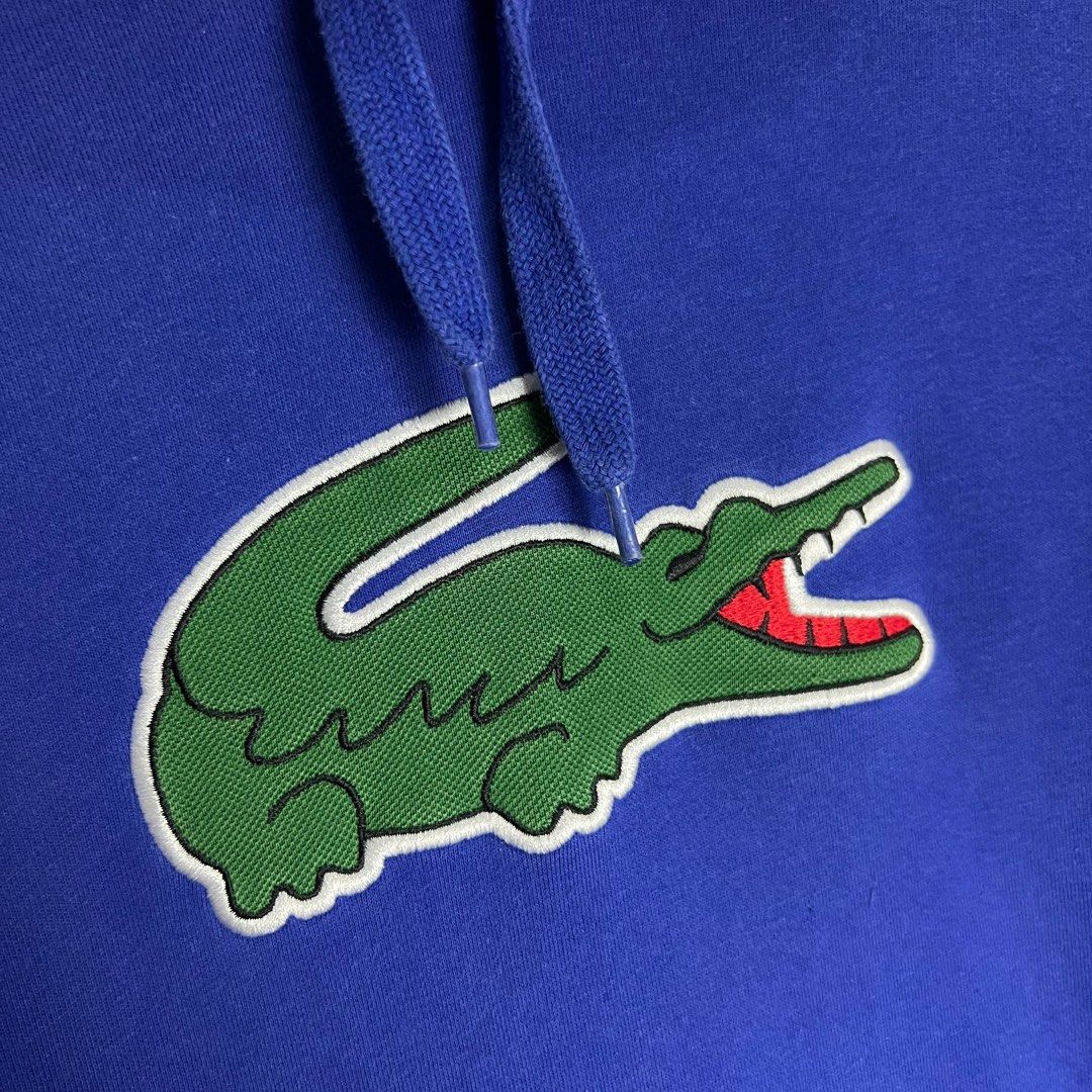LACOSTE Blue Big Logo Hoodie | Authentic (Category: Hoodies) located in Marawi City. Submitted by lazythrifter (Listing ID 1394735817, Image 3). Description: PLS CHECK PHOTOS‼️ Size on tag: Small Width: 21 (inch) Length: 28 (inch) - Condition: 9.5/10 Color rate: 9.5/10.