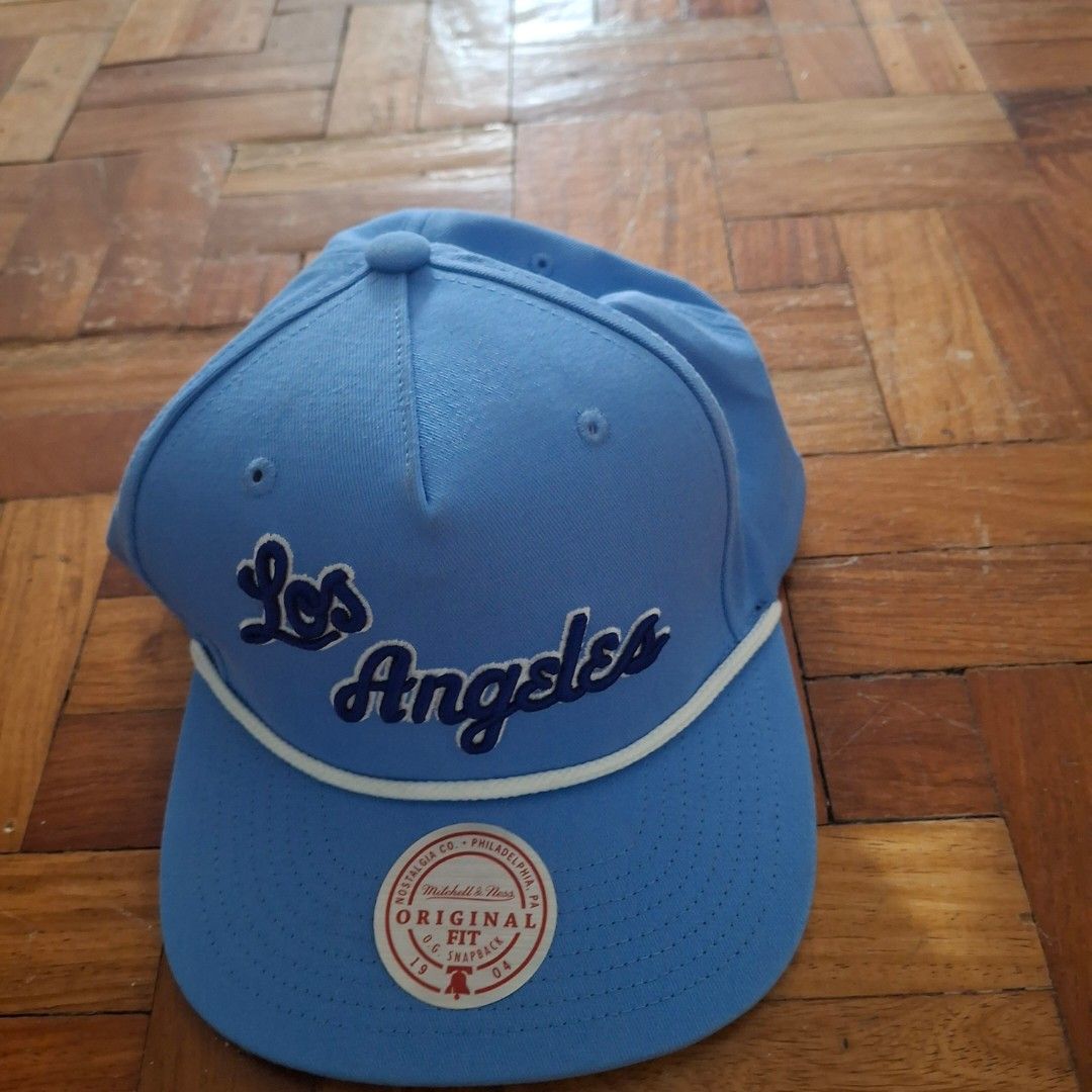 Los Angeles Cap ( Mitchell & Ness ) (Category: Caps & Hats) located in Quezon City. Submitted by markdho (Listing ID 1394630266, Image 1). Description: ‼️Decluttering‼️ Los Angeles Cap ( Mitchell & Ness ) Lightly Used Price : 300 Meet Up : Riverbanks Mall | Gateway Mall MOP : Gcash | Security Bank.