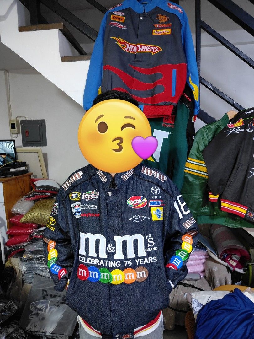 M&M's Racing Jacket (Category: Coats, Jackets and Outerwear) located in Pandi. Submitted by yanyan_apparel.store08 (Listing ID 1394647445, Image 1). Description: Remake Remake - Dark denim jacket - Features patches: M&M's, Toyota, Interstate Batteries - Celebrates M&M's 75th anniversary - Front zipper closure - Ribbed cuffs with M&M's branding - Large M&M's and Toyota logos on back - Number 18 on sleeves.