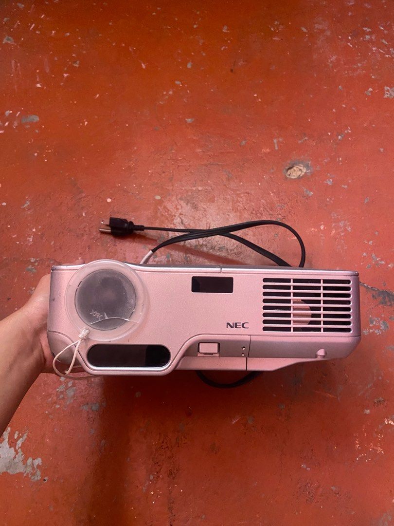 NEC NP60 DLP Projector – Working, Bright Lamp (Category: Projectors) located in Manila. Submitted by lezzhiedeals (Listing ID 1394608401, Image 3). Description: Key Features: Brightness: ~3000 lumens (clear image even in lit rooms) Native resolution: XGA (1024×768) Compact and lightweight design, easy to carry Includes power cable Condition: • Unit powers on and projects clearly (see actual photo) • Lamp light is stable (not blinking) • Normal co