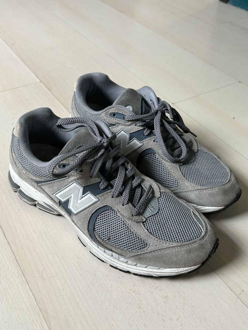 New Balance 2002R Grey Sneakers (Category: Sneakers) located in Manila. Submitted by decluttteringz (Listing ID 1394610650, Image 1). Description: - New Balance 2002R - Color: Grey - Size: US 9.5, UK 9, EUR 43 - Mesh upper with suede overlays - Lace-up closure - Cushioned midsole - New Balance logo detail.