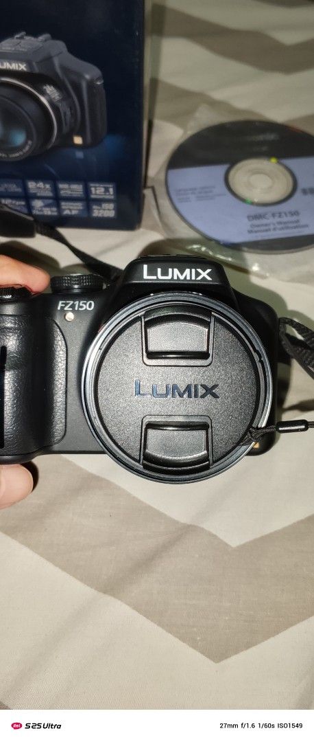 Panasonic Lumix DMC-FZ150 Digital Camera (Category: Cameras) located in Quezon City. Submitted by expe888 (Listing ID 1394772858, Image 3). Description: - Panasonic Lumix DMC-FZ150 digital camera - Includes original box - Comes with charger and accessories - Black camera - Model: DMC-FZ150PUK - Lens cap and strap included.