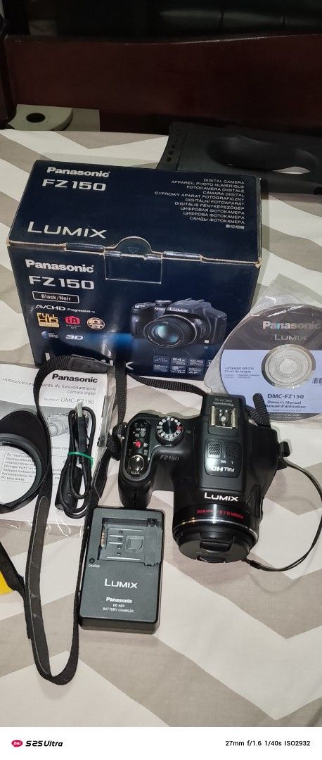 Panasonic Lumix DMC-FZ150 Digital Camera (Category: Cameras) located in Quezon City. Submitted by expe888 (Listing ID 1394772858, Image 1). Description: - Panasonic Lumix DMC-FZ150 digital camera - Includes original box - Comes with charger and accessories - Black camera - Model: DMC-FZ150PUK - Lens cap and strap included.