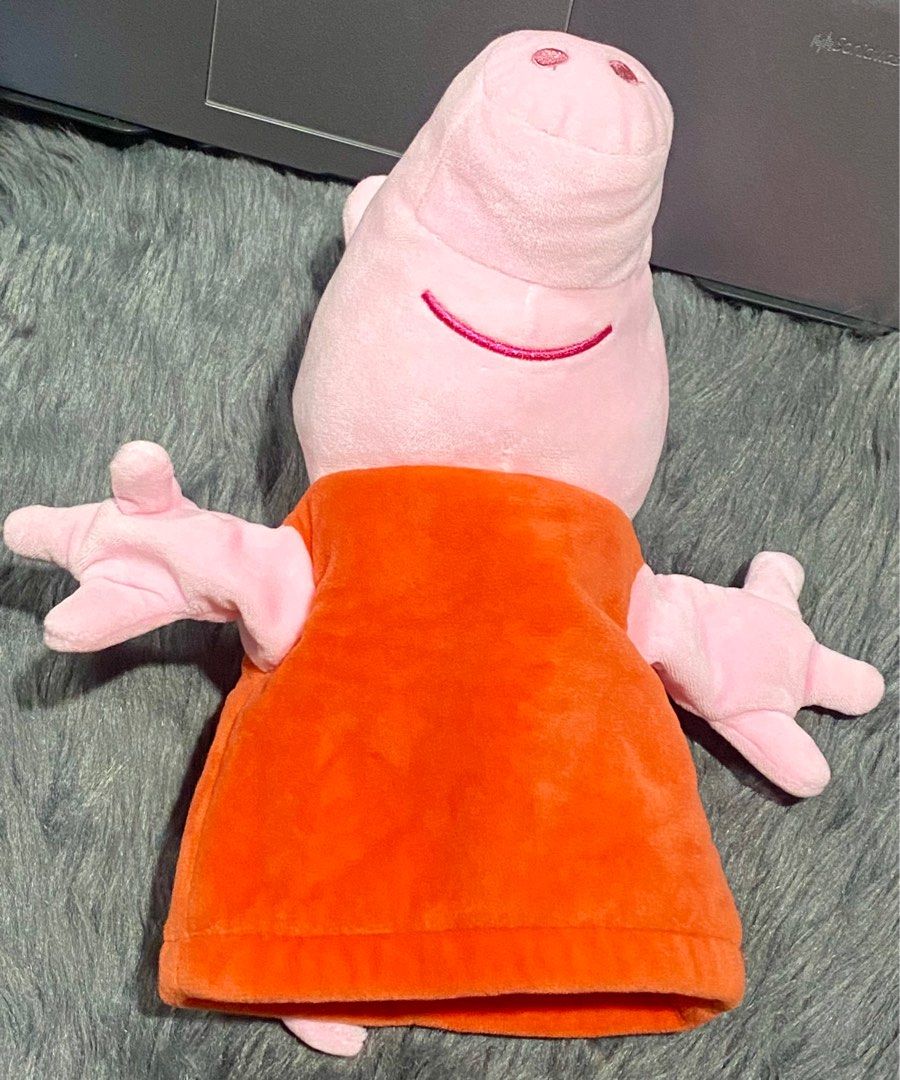 Peppa Pig Hand Puppet Plush 🐷 (Category: Plushies & Soft Toys) located in Makati City. Submitted by ahli_sbd (Listing ID 1394779345, Image 1). Description: Hand puppet is in excellent condition, almost like new. Plush has been washed and cleaned, just waiting to find someone to love it! 🐷 💌 - Peppa Pig plush toy - Features a pink body and orange dress - Designed for children aged 2 years and up - Made with 100% polyester fabric and filling - S