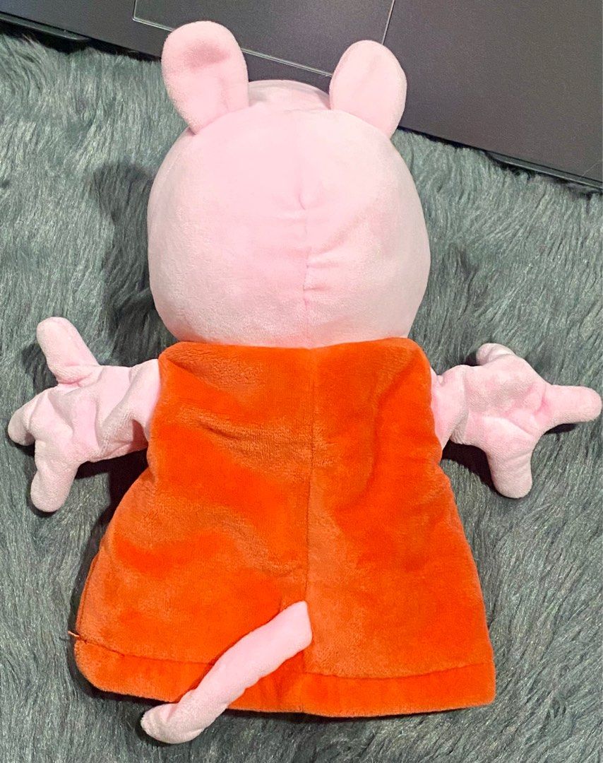 Peppa Pig Hand Puppet Plush 🐷 (Category: Plushies & Soft Toys) located in Makati City. Submitted by ahli_sbd (Listing ID 1394779345, Image 3). Description: Hand puppet is in excellent condition, almost like new. Plush has been washed and cleaned, just waiting to find someone to love it! 🐷 💌 - Peppa Pig plush toy - Features a pink body and orange dress - Designed for children aged 2 years and up - Made with 100% polyester fabric and filling - S