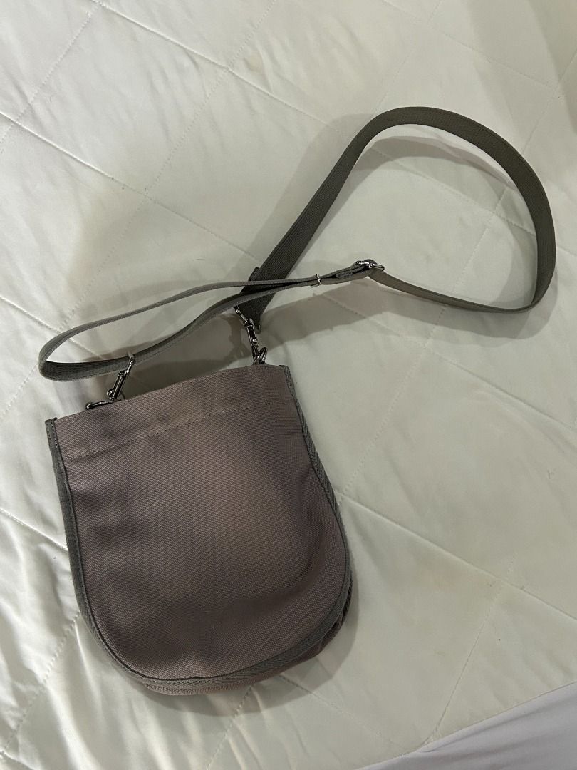 Porter International Shoulder Bag (Category: Shoulder Bags) located in Manila. Submitted by decluttteringz (Listing ID 1394611858, Image 3). Description: - Porter International shoulder bag - Main compartment with zipper closure - Adjustable shoulder strap - Small inner pocket - Neutral color - Porter International logo on front - Button closure on front.