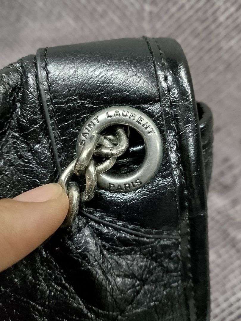 Saint Laurent Nikki (Category: Luxury Bags & Wallets) located in Baguio. Submitted by luxuryitems08 (Listing ID 1394654302, Image 3). Description: -YSL Nikki - Classic black color -coded - Flap closure - Silver chain strap - Saint Laurent logo detail - Interior zippered pocket - Includes brand tag: "Made in Italy".