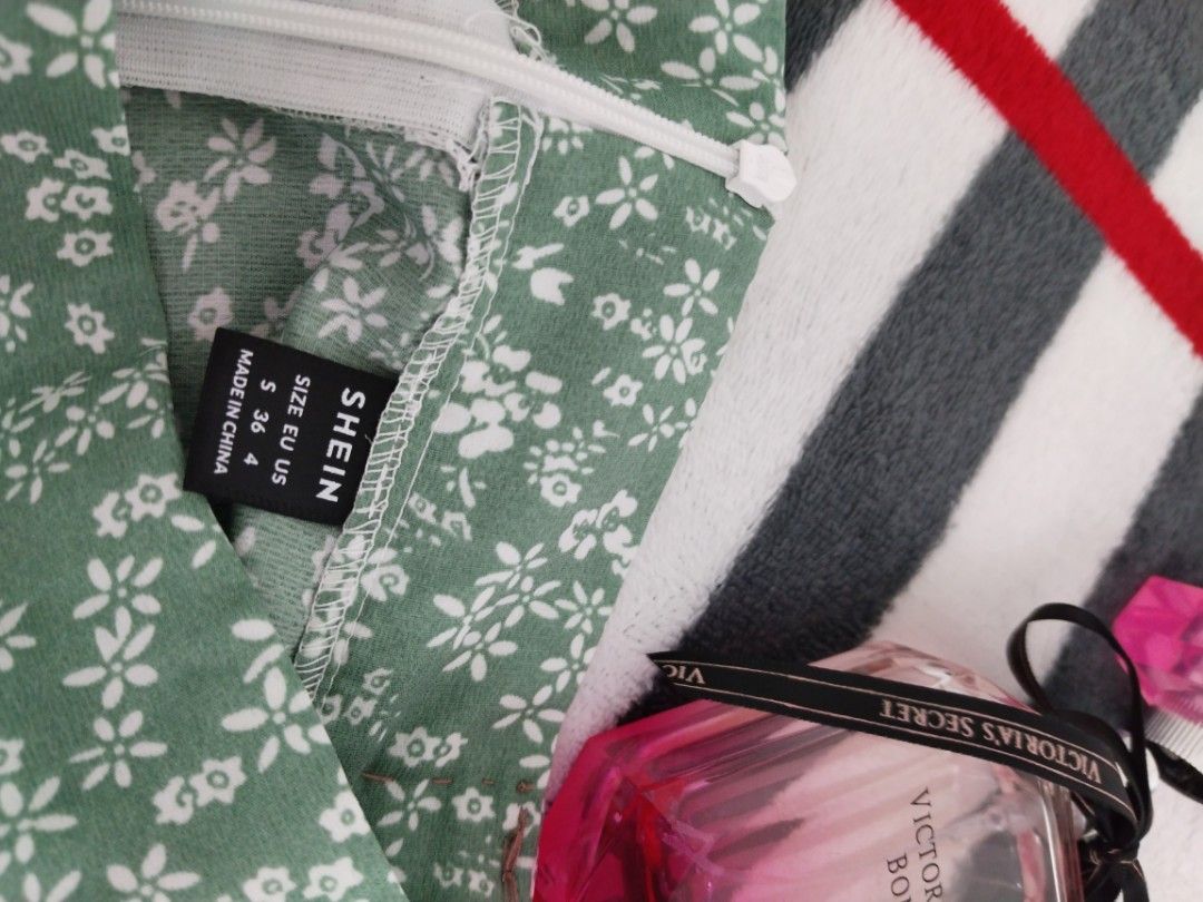 SHEIN Floral Slit Skirt (Category: Skirts) located in Manila. Submitted by gracieee_m (Listing ID 1394763953, Image 2). Description: - SHEIN green floral skirt - Size: S (EU 36, US 4) - High-waisted - Features a side slit - Zipper closure at the back - Lightweight and flowy fabric - Perfect for warm weather - Made in China.