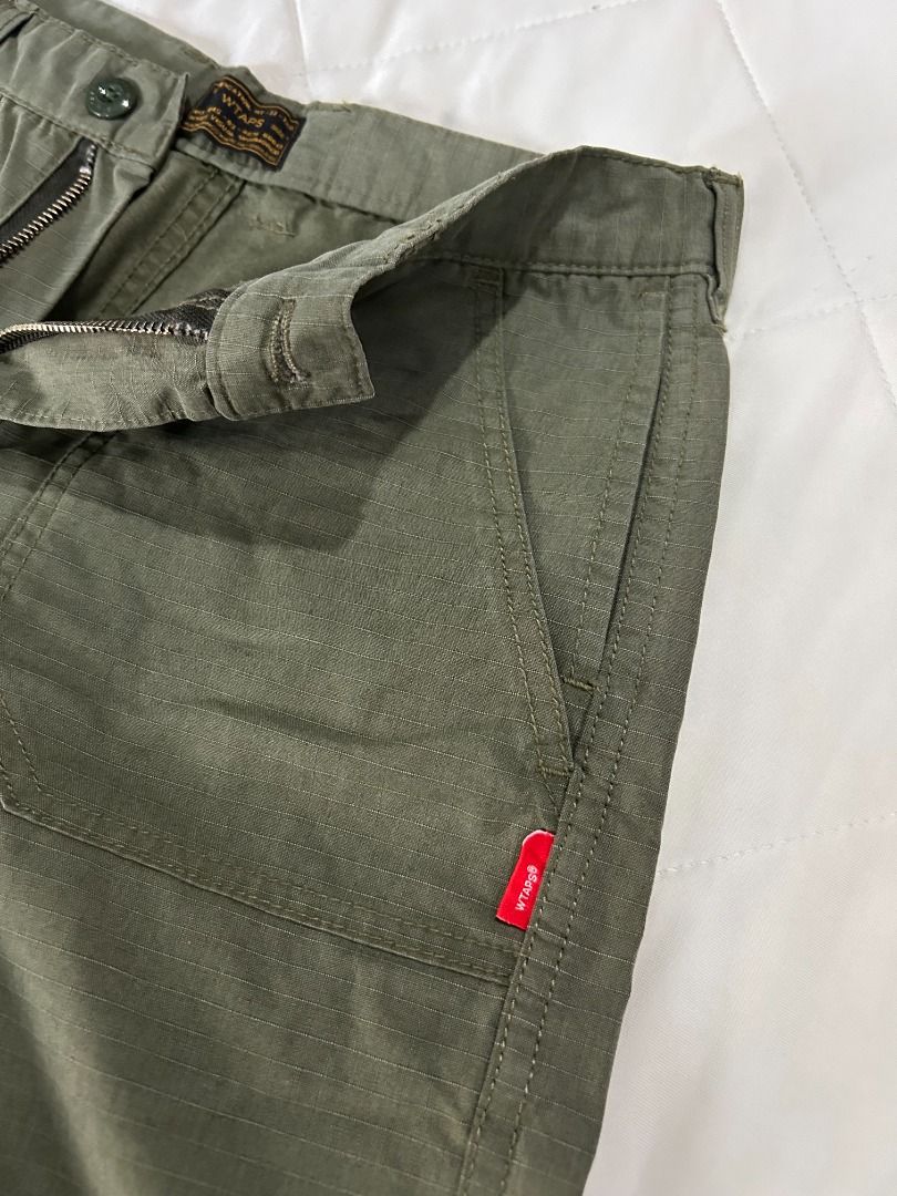 WTAPS Shorts (Category: Shorts) located in Manila. Submitted by decluttteringz (Listing ID 1394611312, Image 3). Description: - WTAPS green shorts - Button and zipper closure - Multiple pockets - WTAPS label detail - Straight cut - Durable fabric.