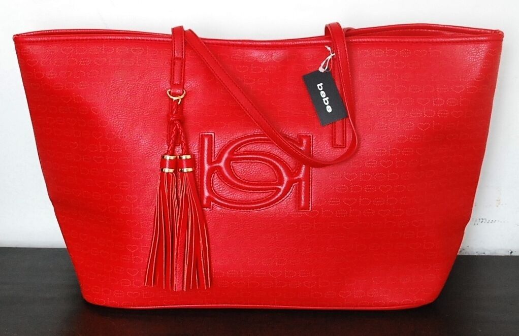 30% Discount Authentic Bebe Lisa Tote Bag (Category: Tote Bags) located in Paranaque City. Submitted by vanitelab (Listing ID 1394824479, Image 1). Description: CLEARANCE SALE LESS 30% (3,400 - 1,020 = 2,380) Authentic and Brand-new BEBE LISA TOTE includes care card Product Description: Material: Shell Polyurethane, Interior Polyester Color: Red Opening: Top-snap Interior: 1 zipped pocket, multiple open pockets Size: (bottom 16.25), top (22.5) x 