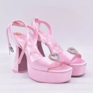 Aldo x Barbie Party Heels (Category: Heels) located in Iloilo. Submitted by erickalala54477 (Listing ID 1394893809, Image 2). Description: - Never Been Used - RFS nakadisplay lang - Size 7 - Comes with original box - US Size: 6.5 / EUR 37 / UK 4 - Features: Platform design, heart-shaped embellishment, holographic finish.