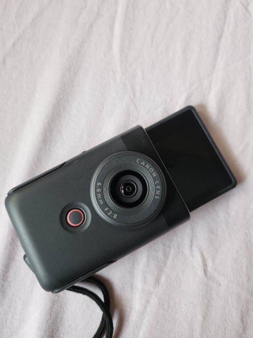 Canon V10 (Category: Cameras) located in Pasig City. Submitted by RainbowPocket (Listing ID 1394842628, Image 2). Description: - Canon v10 camera - Built-in flip screen - 6.6mm f/2.8 lens - Sleek black body - Includes wrist strap Condition: lightly used Rfs:Decluttering .