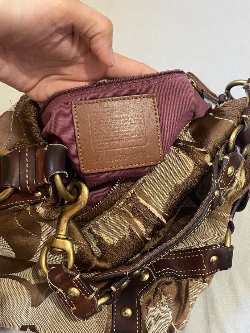 Coach Signature Hobo Bag Small (Category: Luxury Bags & Wallets) located in Lapu Lapu. Submitted by freebear-196d (Listing ID 1394962575, Image 3). Description: - Authentic Coach Signature Hobo bag - Brown and tan signature print - Brown leather accents - Top handle - Gold-tone hardware - Interior pocket with Coach label.