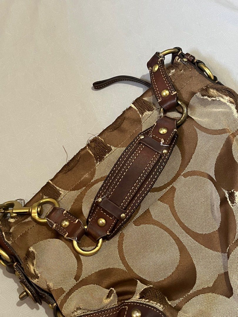 Coach Signature Hobo Bag Small (Category: Luxury Bags & Wallets) located in Lapu Lapu. Submitted by freebear-196d (Listing ID 1394962575, Image 2). Description: - Authentic Coach Signature Hobo bag - Brown and tan signature print - Brown leather accents - Top handle - Gold-tone hardware - Interior pocket with Coach label.