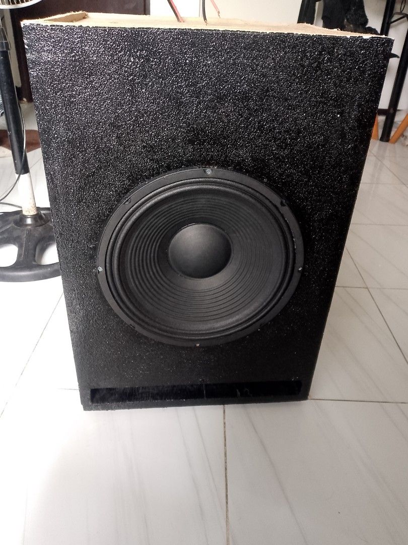 Custom Subwoofer Speaker Box (Category: Soundbars, Speakers & Amplifiers) located in Manila. Submitted by cj1808 (Listing ID 1394866366, Image 1). Description: - Custom-built subwoofer speaker box - Features a large black speaker - Black box with textured finish - Dimensions: 24 inches (H) x 18 inches (W) x 16 inches (D) - Includes wiring for easy connection - Enhances your audio experience.