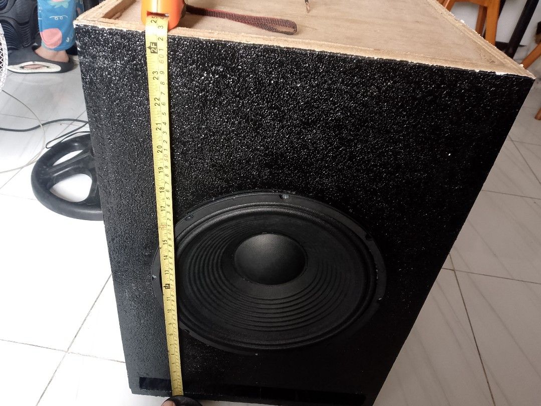 Custom Subwoofer Speaker Box (Category: Soundbars, Speakers & Amplifiers) located in Manila. Submitted by cj1808 (Listing ID 1394866366, Image 2). Description: - Custom-built subwoofer speaker box - Features a large black speaker - Black box with textured finish - Dimensions: 24 inches (H) x 18 inches (W) x 16 inches (D) - Includes wiring for easy connection - Enhances your audio experience.