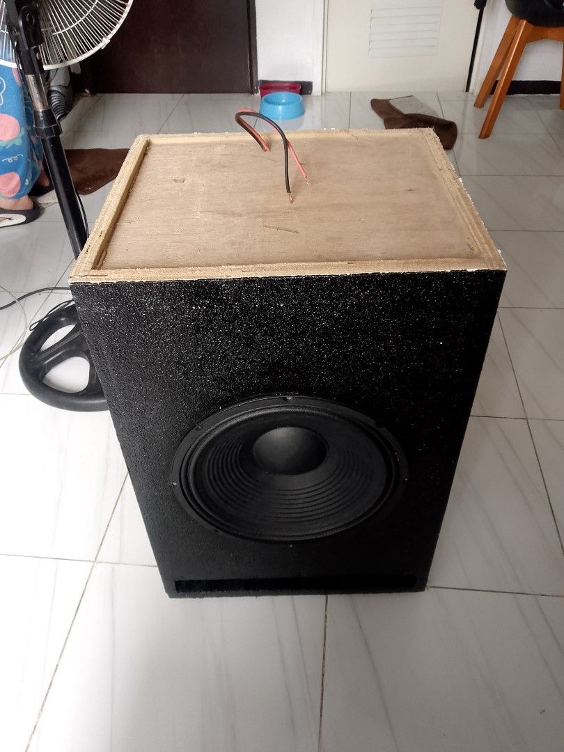 Custom Subwoofer Speaker Box (Category: Soundbars, Speakers & Amplifiers) located in Manila. Submitted by cj1808 (Listing ID 1394866366, Image 3). Description: - Custom-built subwoofer speaker box - Features a large black speaker - Black box with textured finish - Dimensions: 24 inches (H) x 18 inches (W) x 16 inches (D) - Includes wiring for easy connection - Enhances your audio experience.