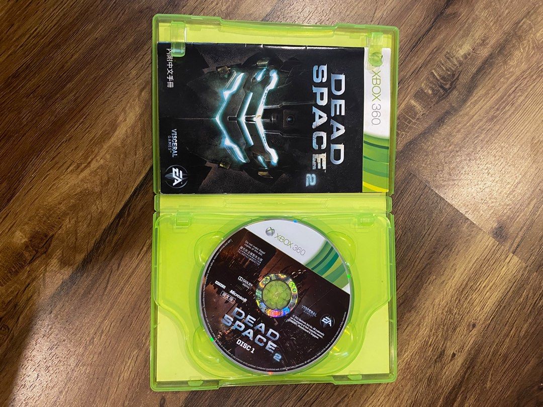 Dead Space 2 - Xbox 360 (Category: Xbox) located in Paranaque City. Submitted by boogru (Listing ID 1394810552, Image 2). Description: - Dead Space 2 for Xbox 360 - Includes both game discs and original case - Game language: English and Chinese - Case features gameplay details and game features - Mentions online pass - Made in Singapore.