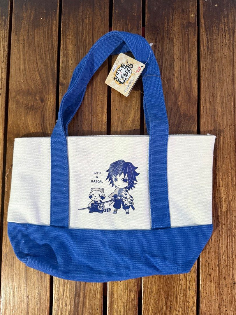 Demon Slayer Giyu x Rascal Tote Bag (Category: Tote Bags) located in Manila. Submitted by keeponsparklin (Listing ID 1394881308, Image 1). Description: Fresh from Japan 🇯🇵 Demon Slayer Tote Bag 100% Authentic ✨ Condition: 10/10 💙 11.75” wide x 8” tall📏 Price is Negotiable 💸 Mod: Lalamove, Grab, J&T Mop: Gcash.