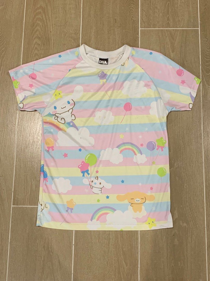 Cinnamoroll Pastel Rainbow T-shirt (Category: Shirts) located in Cavite. Submitted by ayessafe (Listing ID 1394869455, Image 1). Description: SIZE: Up to Semi-Large, breathable and stretchable fabric. - Adorable Cinnamoroll T-shirt. - Features a colorful pastel rainbow design. - Includes Cinnamoroll characters, rainbows, balloons, and stars. - Made of lightweight material. - Front and back are printed. .