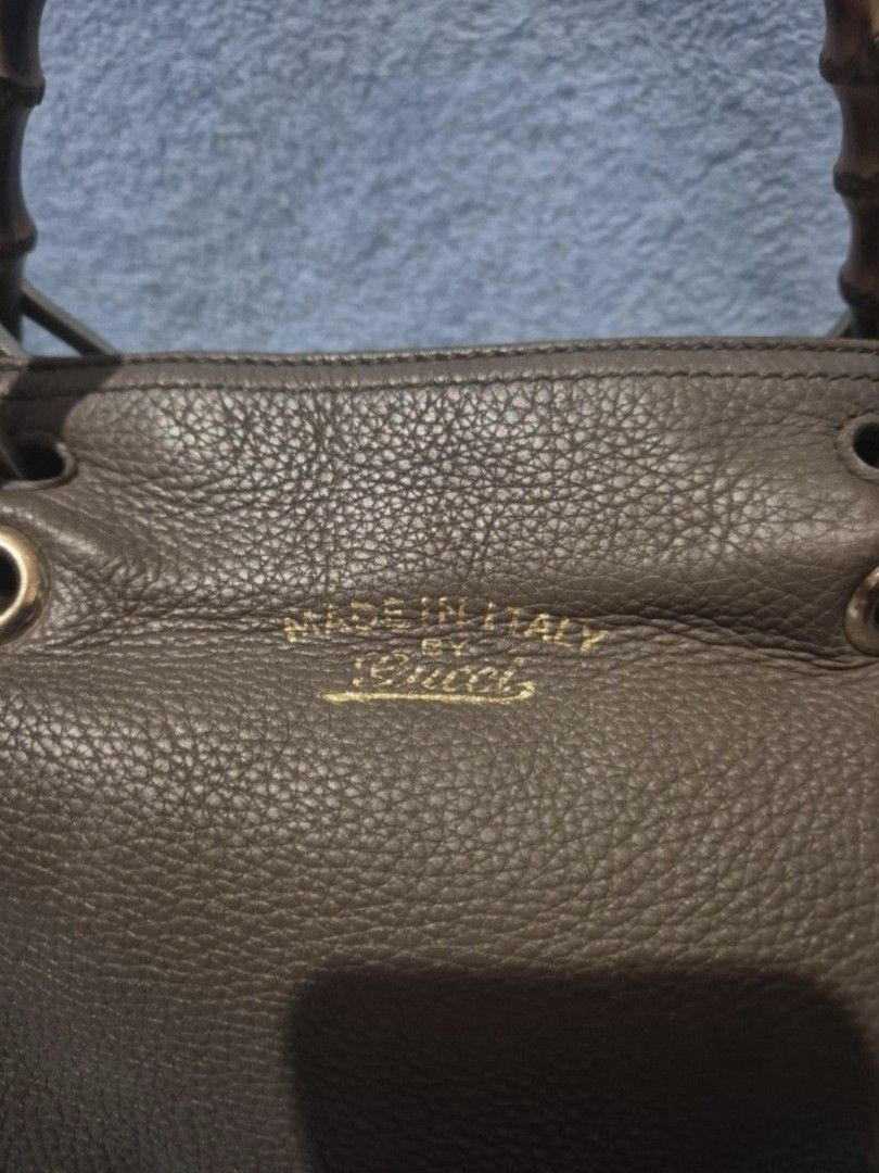 Gucci Bamboo Handle Bag (Category: Luxury Bags & Wallets) located in Valenzuela. Submitted by randomlyn (Listing ID 1394854860, Image 2). Description: - Authentic Gucci handbag - Iconic bamboo handles - Zip closure - Spacious interior with multiple compartments - Made in Italy - Leather exterior - Gucci logo and serial number inside - Detachable strap - With Entrupy.