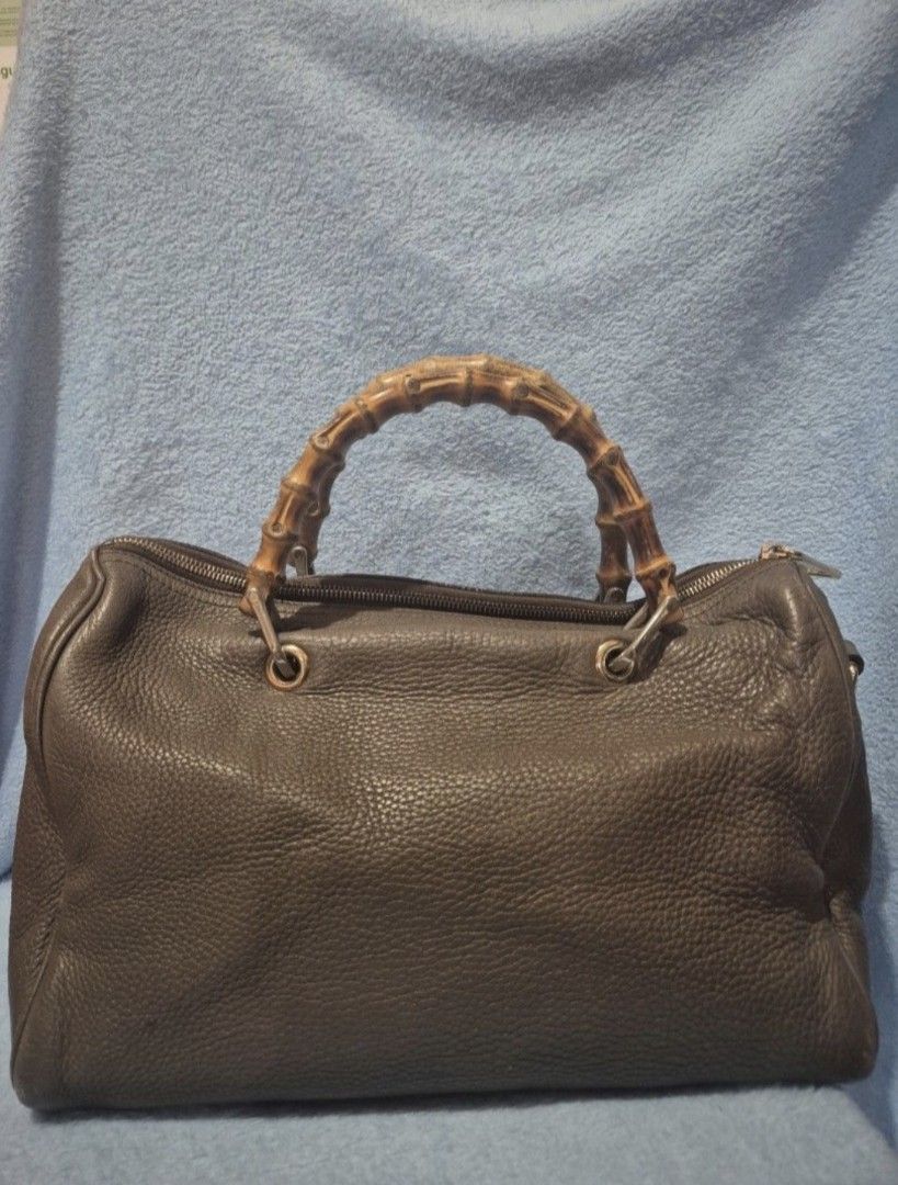 Gucci Bamboo Handle Bag (Category: Luxury Bags & Wallets) located in Valenzuela. Submitted by randomlyn (Listing ID 1394854860, Image 3). Description: - Authentic Gucci handbag - Iconic bamboo handles - Zip closure - Spacious interior with multiple compartments - Made in Italy - Leather exterior - Gucci logo and serial number inside - Detachable strap - With Entrupy.