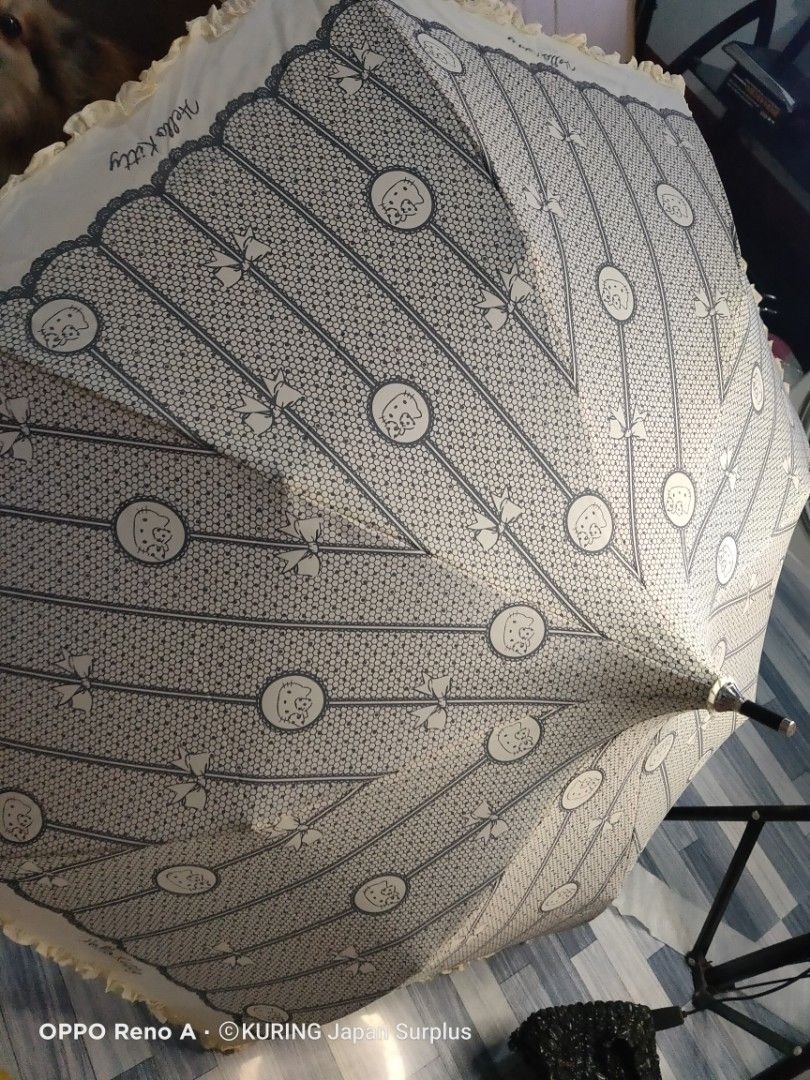 Hello Kitty Lace Umbrella (Category: Umbrellas) located in Batangas. Submitted by ems10. (Listing ID 1394817622, Image 1). Description: - Kitty lace design umbrella - White and gray color scheme - Features Kitty graphics - Includes a matching carrying case - Black handle with white ruffle detail - Japanese surplus item.