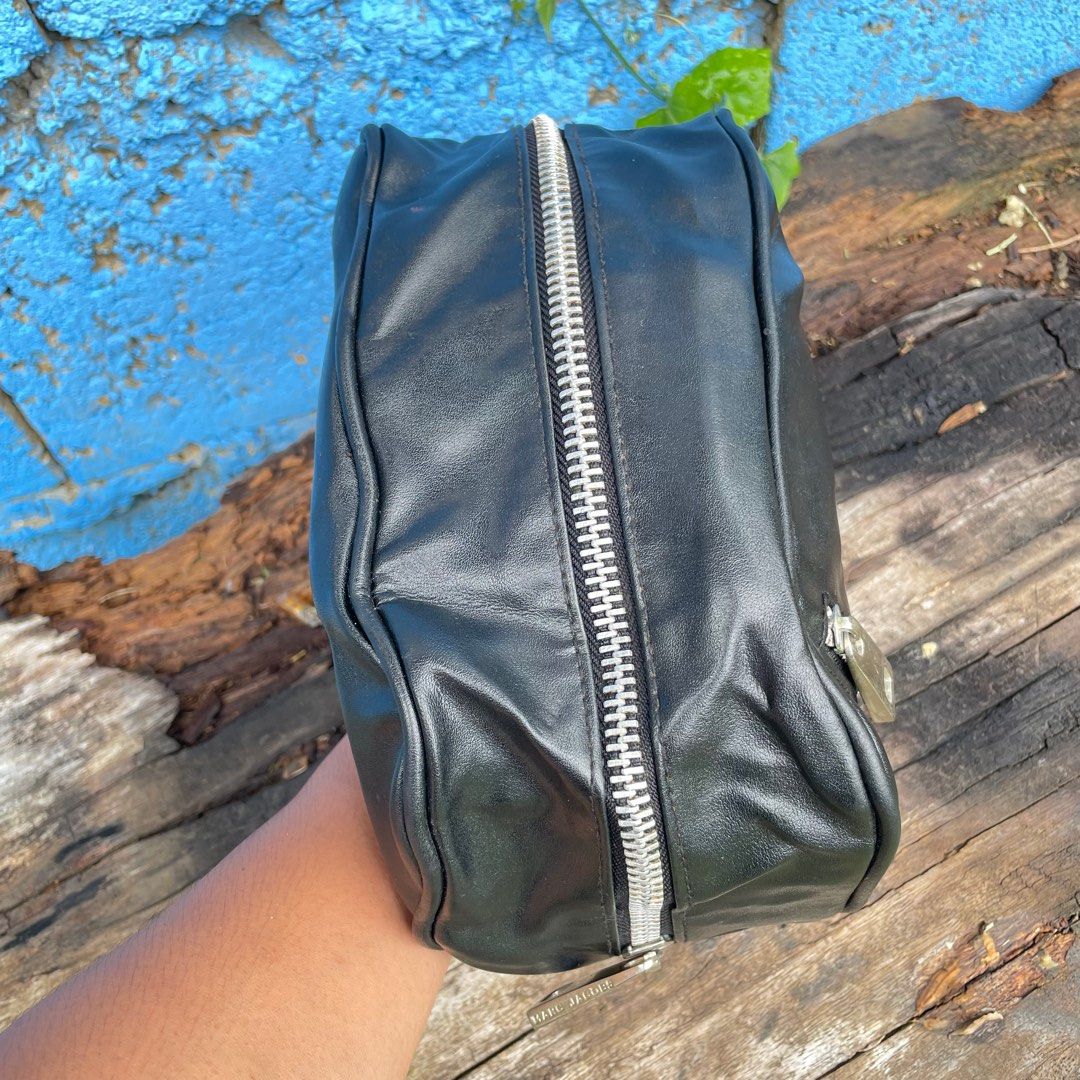 Marc Jacobs Men's Dopp Kit Toiletry Leather Bag (Category: Belt bags, Clutches and Pouches) located in Zamboanga. Submitted by thriftbyeems (Listing ID 1394811172, Image 2). Description: WTS Marc Jacobs Men’s Dopp Kit Toiletry Leather Bag Silver hardware Zippered closure Preloved, very nice good condition Small zipper pocket on the front 10 inches long 3.5 inches width 5.5 inches height PM.
