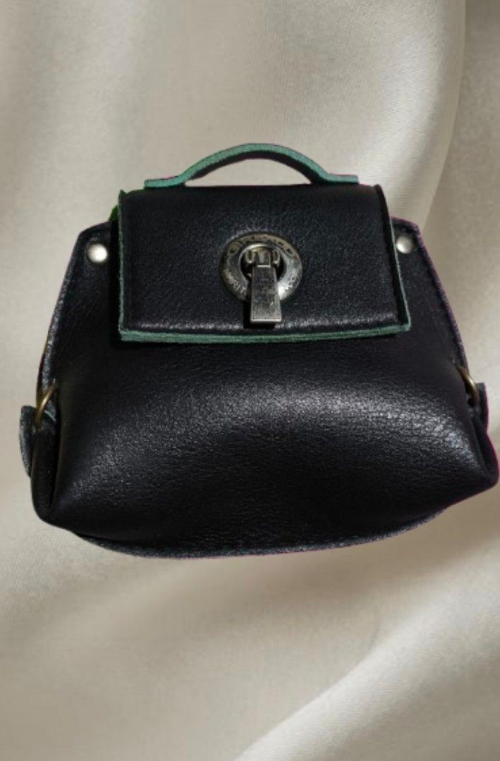 Marithe Francois Girbaud Paris Coin Purse (Category: Luxury Bags & Wallets) located in Mandaluyong City. Submitted by gracious.30 (Listing ID 1394898575, Image 1). Description: Vintage hard to find item - Black coin purse - Unique clasp detail - Top handle - Flap closure - Leather exterior - Compact size.