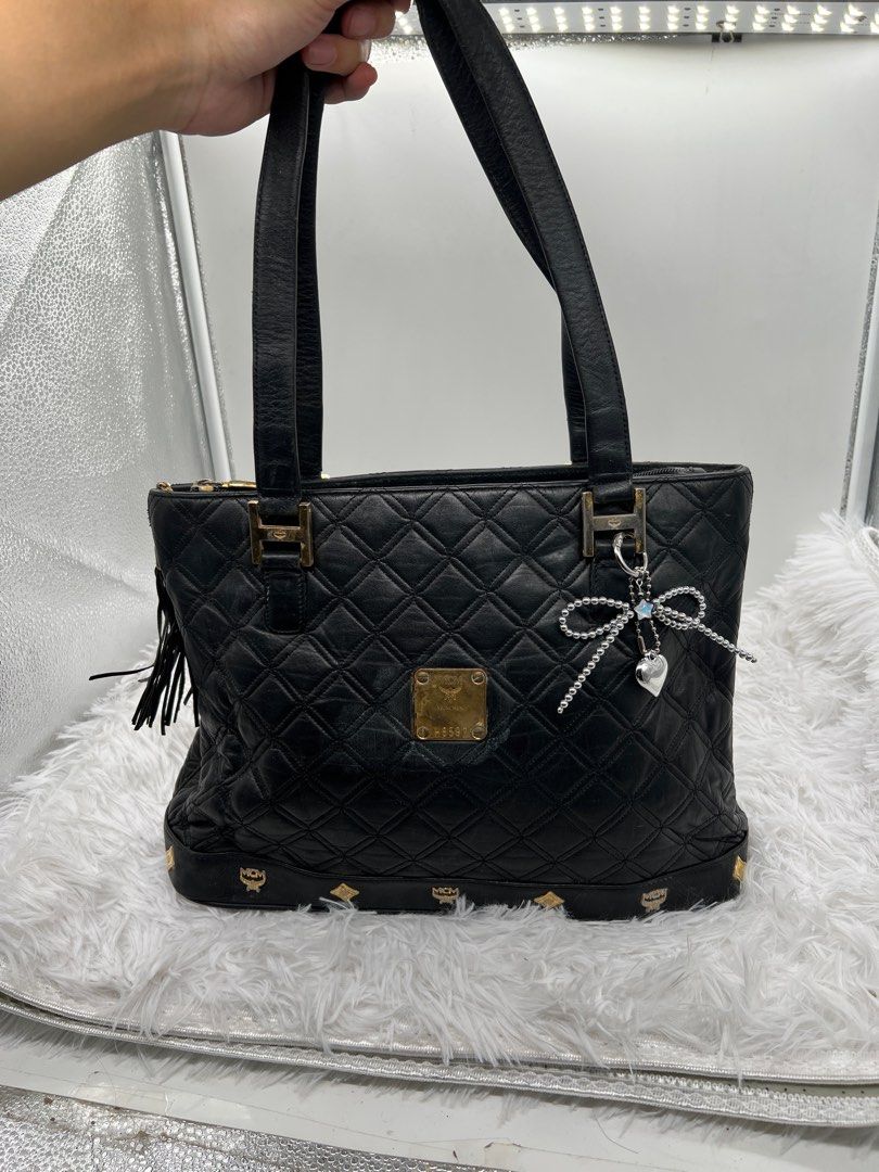 MCM Germany quilted leather black shoulder tote bag (Category: Tote Bags) located in Kawit. Submitted by aellavier2 (Listing ID 1394957821, Image 1). Description: needs cleaning inside. vintage preloved signs of use. feel free to zoom in pics .