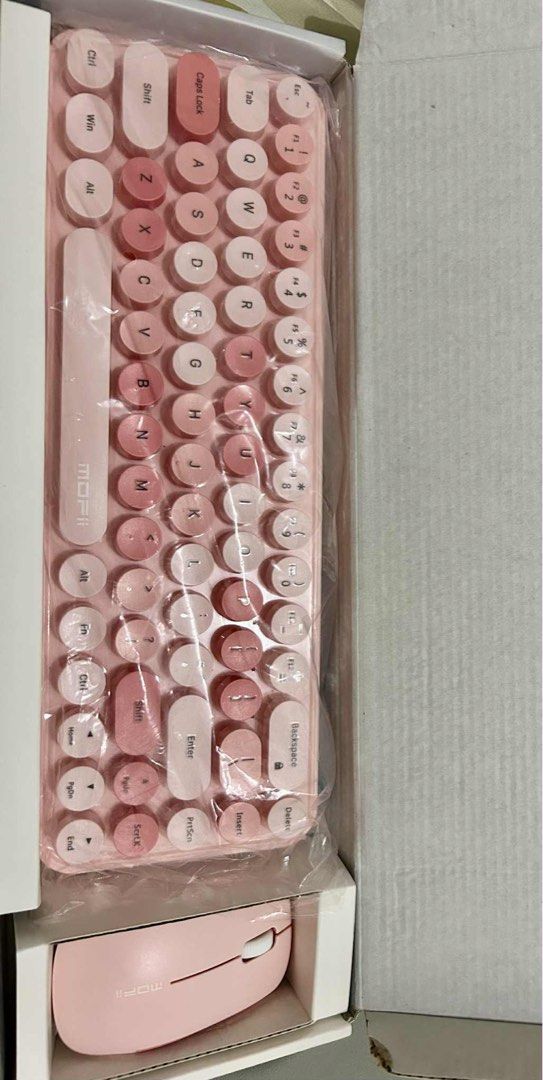 MOFii Wireless Keyboard and Mouse Set (Category: Computer Keyboard) located in Pasig City. Submitted by Fashionettely (Listing ID 1394946797, Image 2). Description: - MOFii Candy XR wireless keyboard and mouse set NEW - Stylish pink color - Retro round keycap design - Includes keyboard and matching mouse RFS: Hindi nagamit, may gaming PC na. Bought last month lang. Still New🧡.