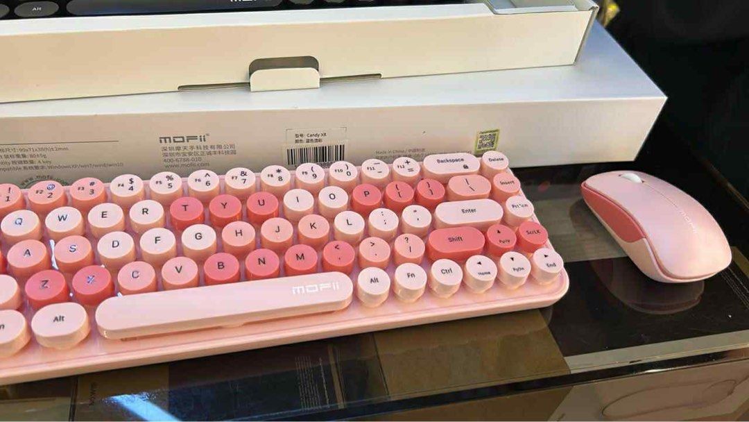 MOFii Wireless Keyboard and Mouse Set (Category: Computer Keyboard) located in Pasig City. Submitted by Fashionettely (Listing ID 1394946797, Image 1). Description: - MOFii Candy XR wireless keyboard and mouse set NEW - Stylish pink color - Retro round keycap design - Includes keyboard and matching mouse RFS: Hindi nagamit, may gaming PC na. Bought last month lang. Still New🧡.