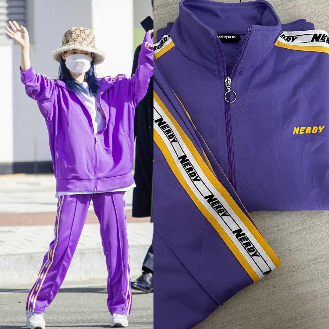 Nerdy Tracksuit Set - Purple (Category: Sets & Coordinates) located in Calamba. Submitted by merrymerida (Listing ID 1394789434, Image 1). Description: - Nerdy tracksuit set - Color: Purple - Includes: Zip-up jacket and matching pants - Jacket features: Nerdy logo, stripe detailing, high collar, front pockets, size S - Pants features: Nerdy logo, stripe detailing, elastic waistband, drawstring, size M - Made in Vietnam.
