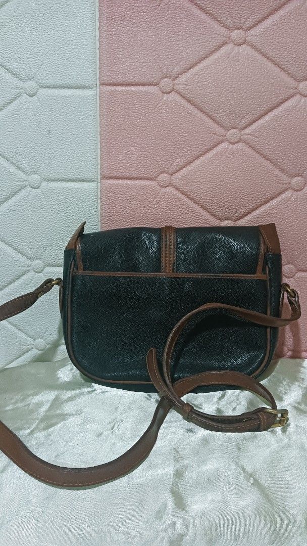 Pierre Balmain Shoulder Bag (Category: Luxury Bags & Wallets) located in Laoag. Submitted by catrnzjb153008 (Listing ID 1394895431, Image 2). Description: - Pierre Balmain shoulder bag - Black body with brown accents - Brown shoulder strap - Flap closure - Gold-toned zipper - Interior Pierre Balmain label - Perfect for everyday use.