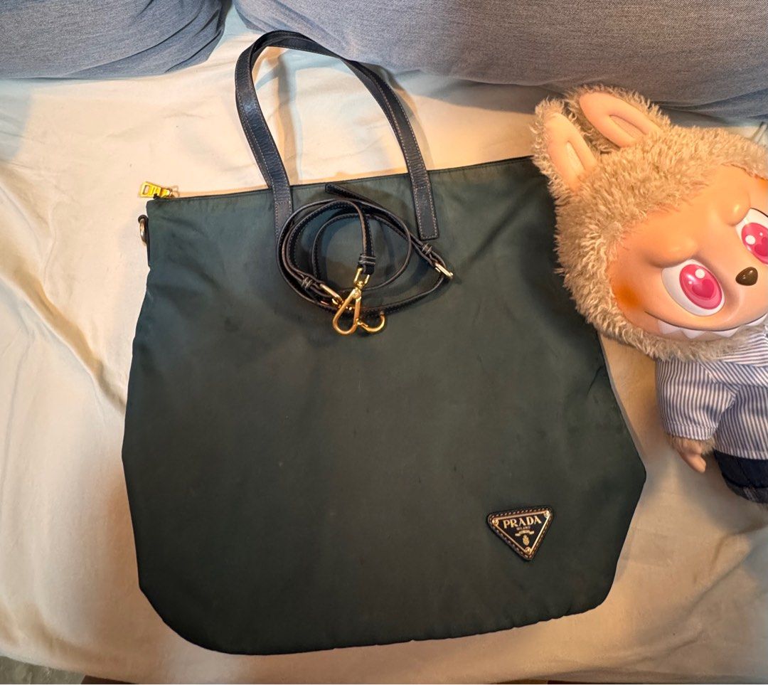 Prada Nylon 2-Way (Category: Luxury Bags & Wallets) located in Bacoor. Submitted by mommyjameetan (Listing ID 1394822482, Image 1). Description: Authentic. Prada 2 way bag: Shoulder bag with sling..